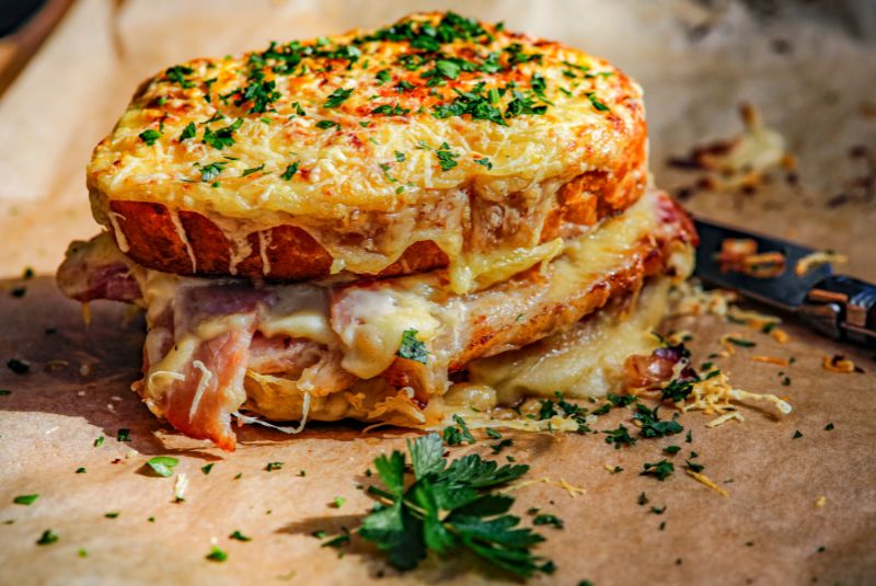 The Croque Monsieur is believed to have originated in French cafés and bars as a quick and satisfying snack for patrons.